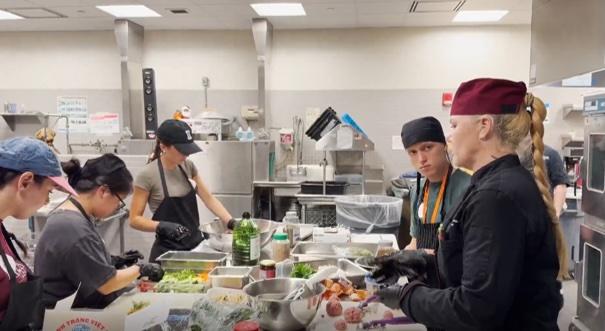 Chef Jenafer with students in Marriott Center kitchen